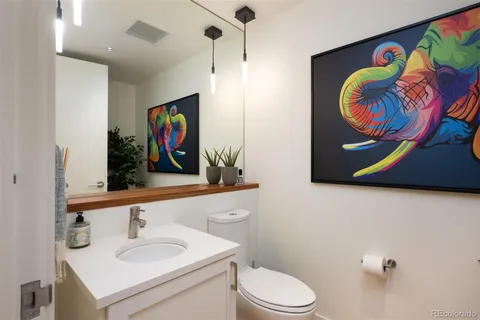 a bathroom with a sink a vanity and a mirror