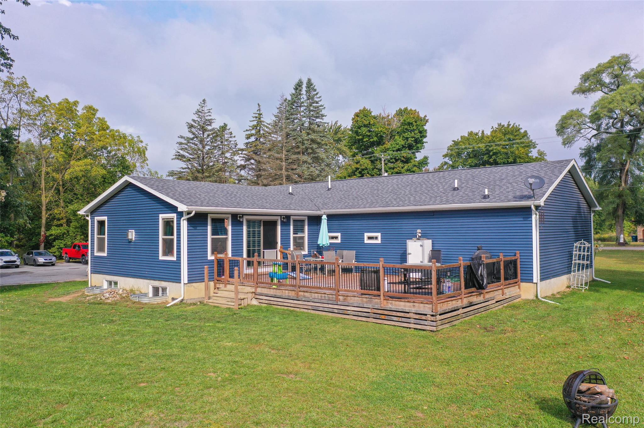 11141 Farrand Road Montrose, MI 48457 - Photo 35 of 51 Rear view of property with a deck, a yard, and a shingled roof