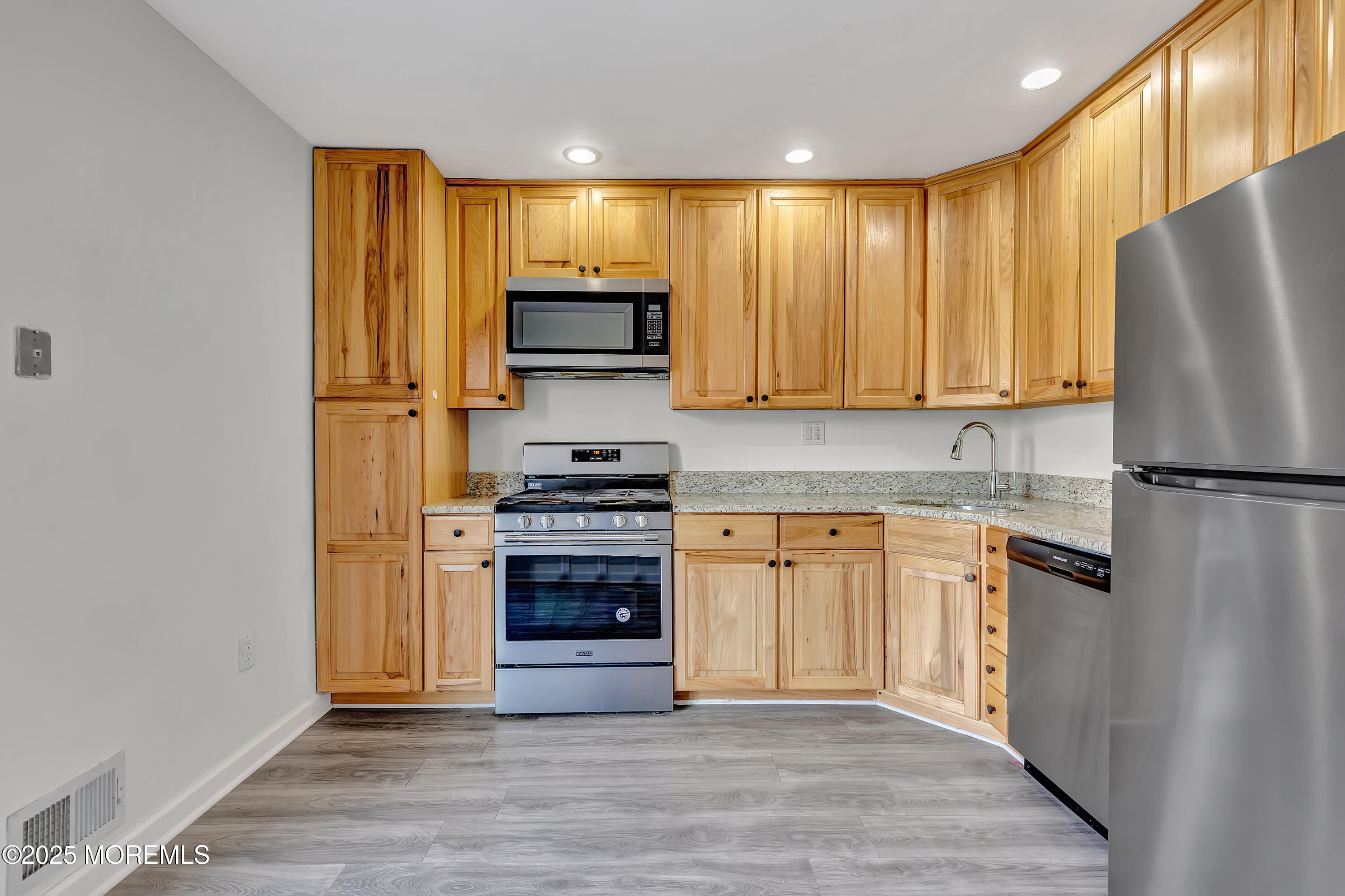 7 Creek Road Brick, NJ 08724 - Photo 12 of 26 a kitchen with stainless steel appliances granite countertop a refrigerator stove and sink