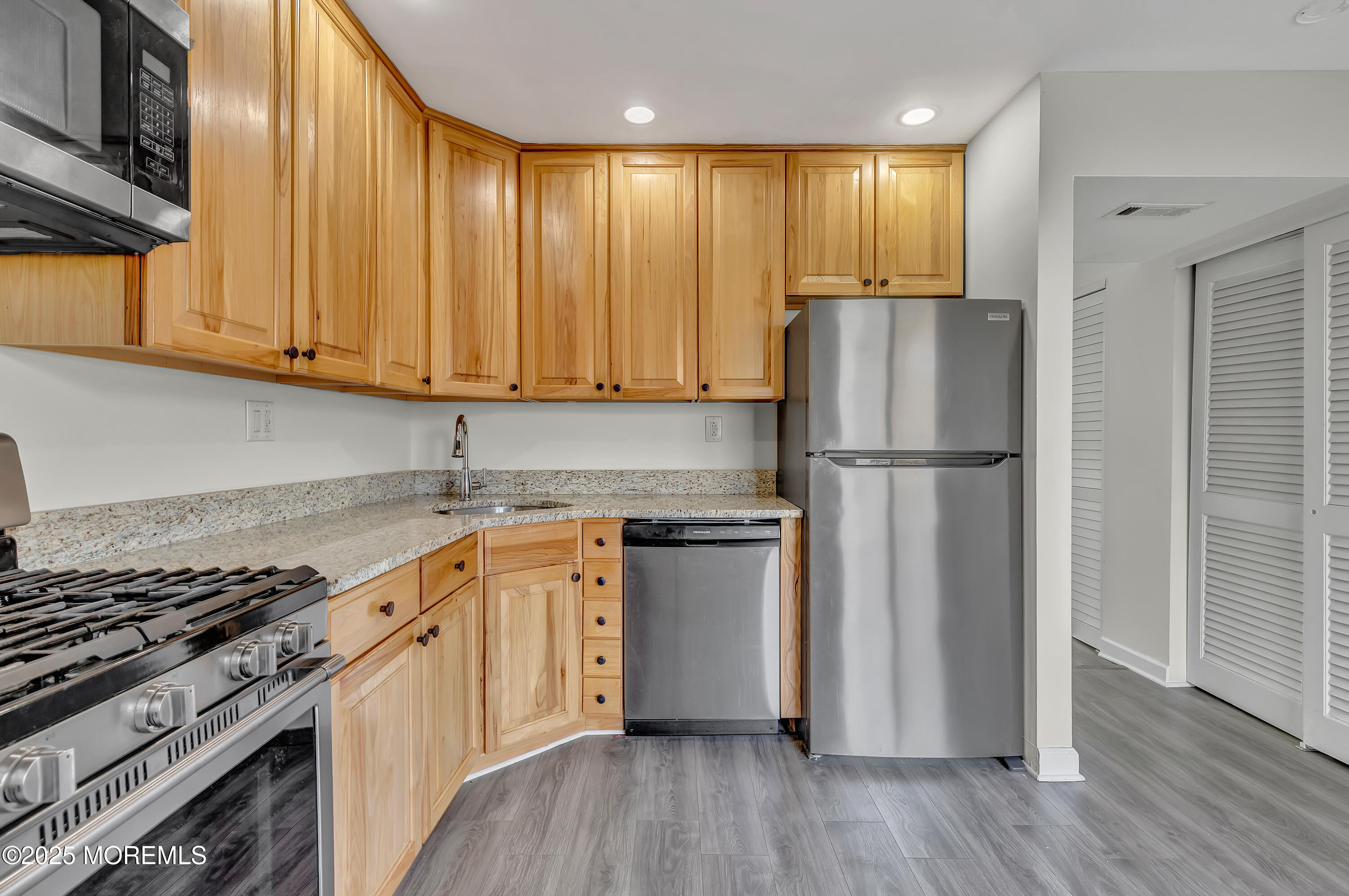 7 Creek Road Brick, NJ 08724 - Photo 16 of 26 a kitchen with stainless steel appliances granite countertop a refrigerator sink and stove