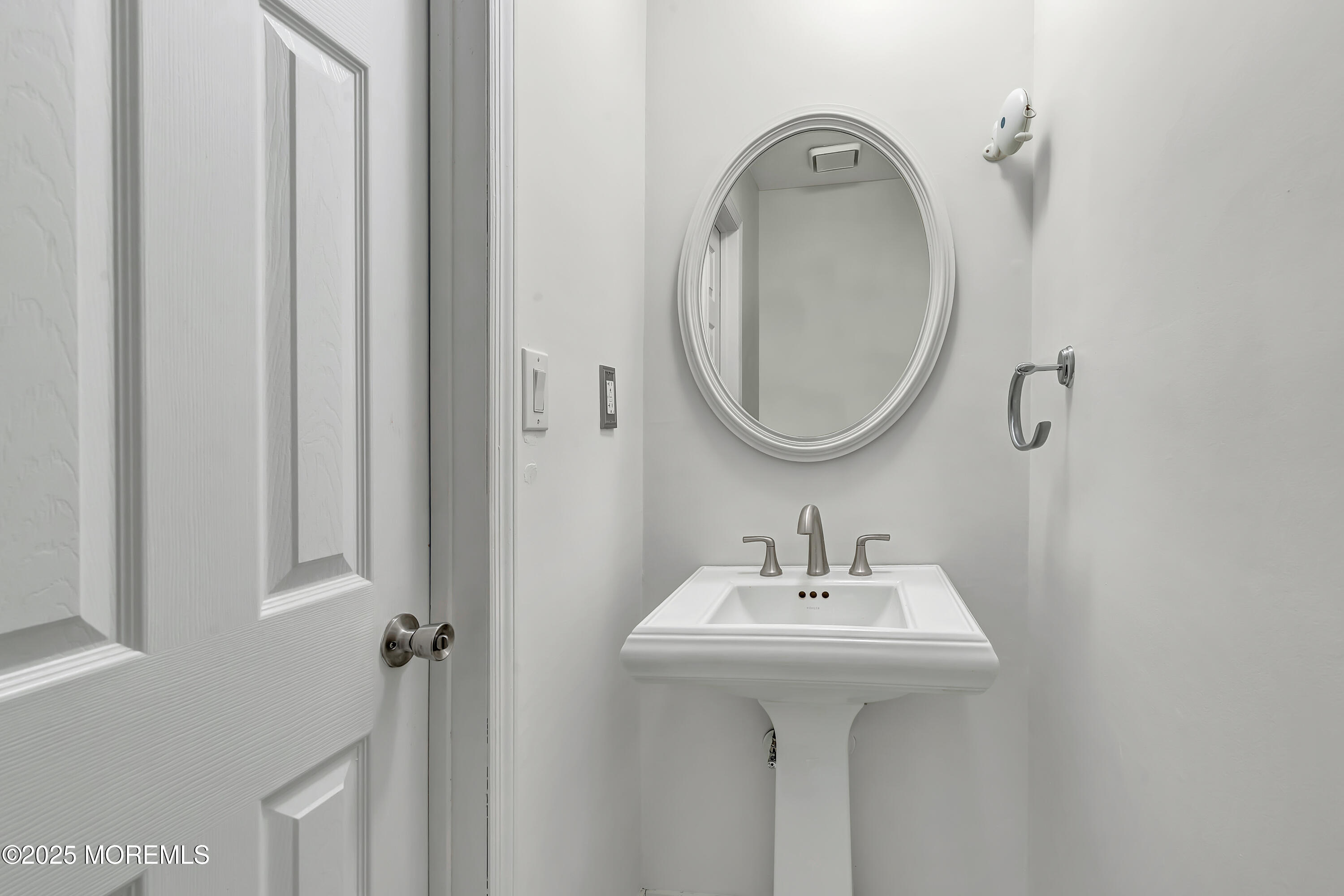 7 Creek Road Brick, NJ 08724 - Photo 17 of 26 a bathroom with a sink and a mirror