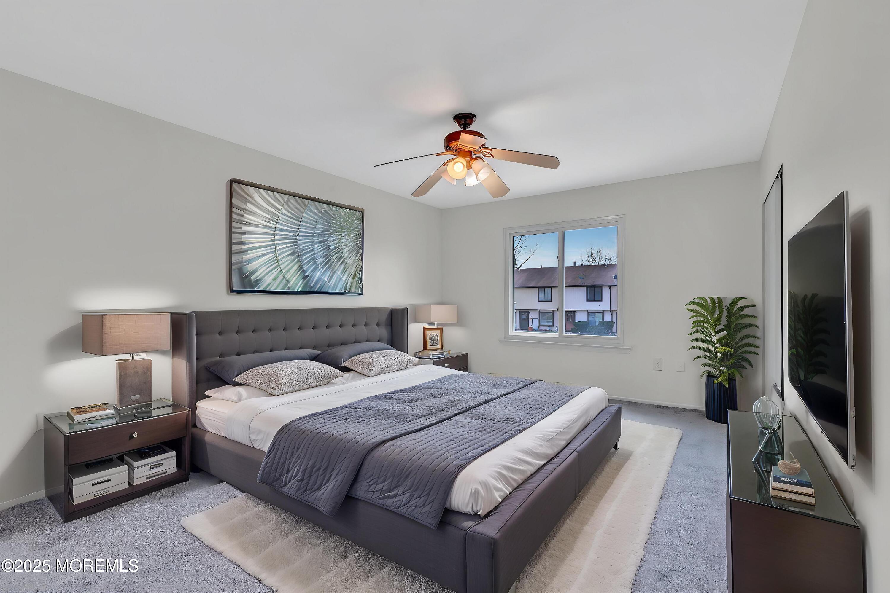 7 Creek Road Brick, NJ 08724 - Photo 2 of 26 a bedroom with a bed and a flat screen tv