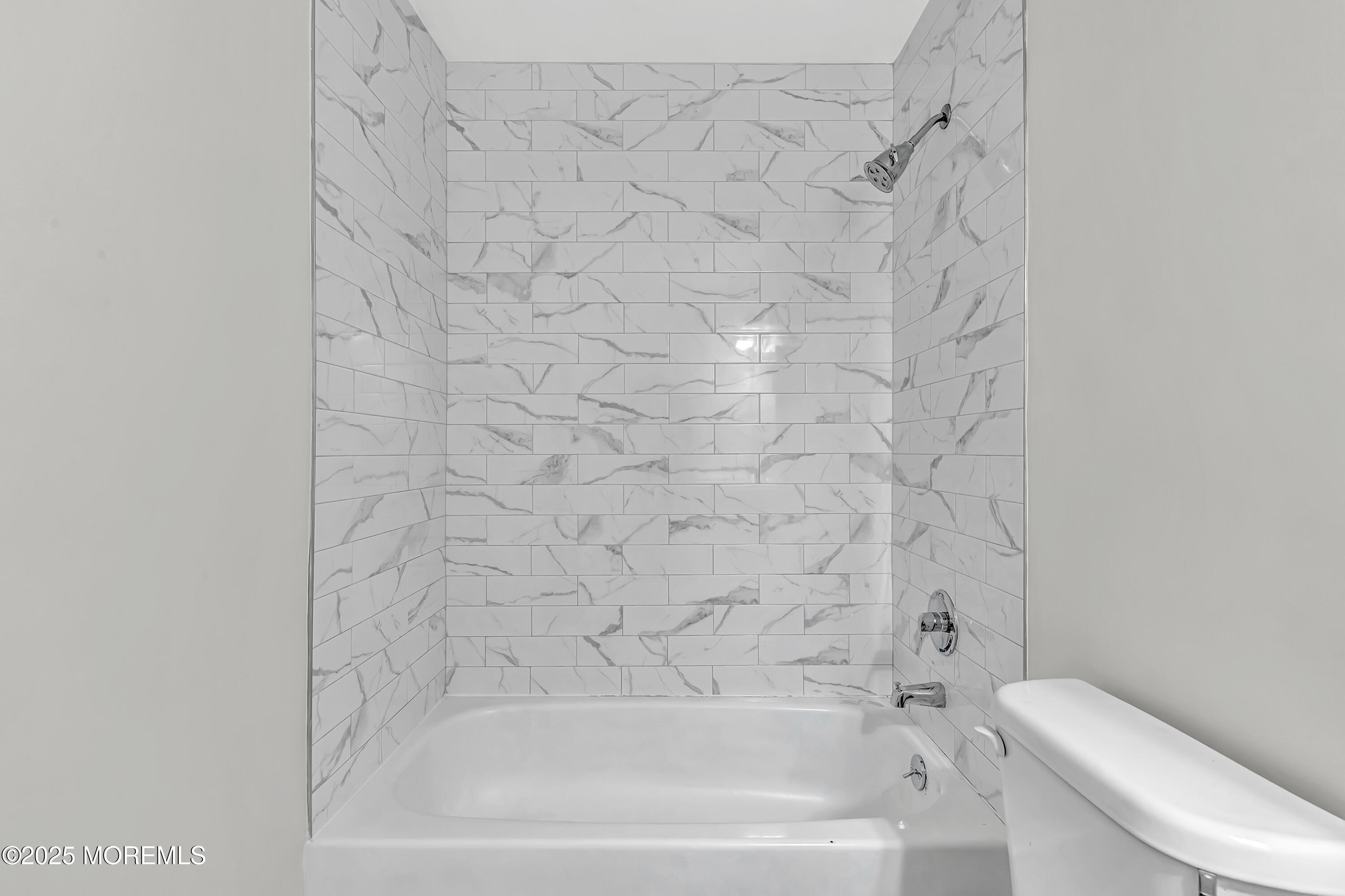 7 Creek Road Brick, NJ 08724 - Photo 24 of 26 a bathroom with a bathtub and a toilet