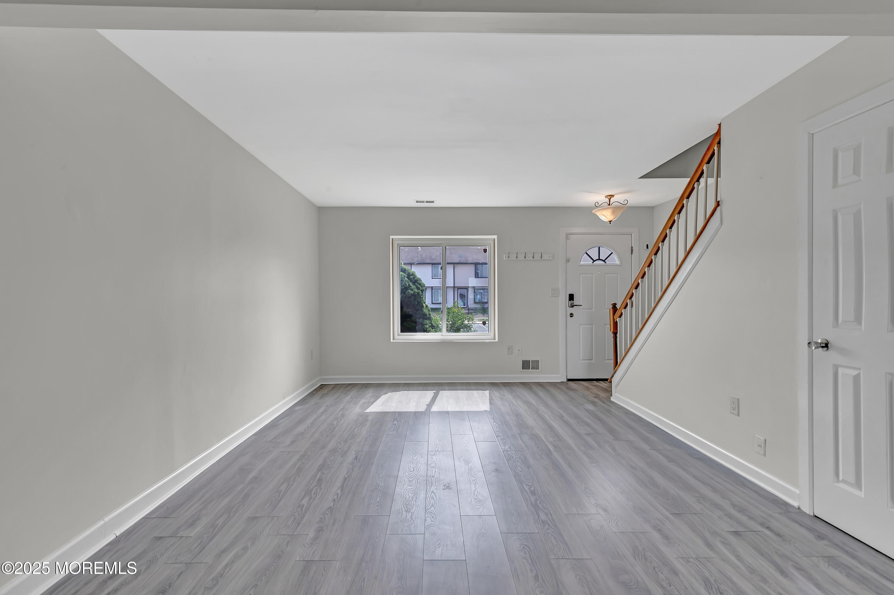 7 Creek Road Brick, NJ 08724 - Photo 8 of 26 wooden floor in an empty room with a window