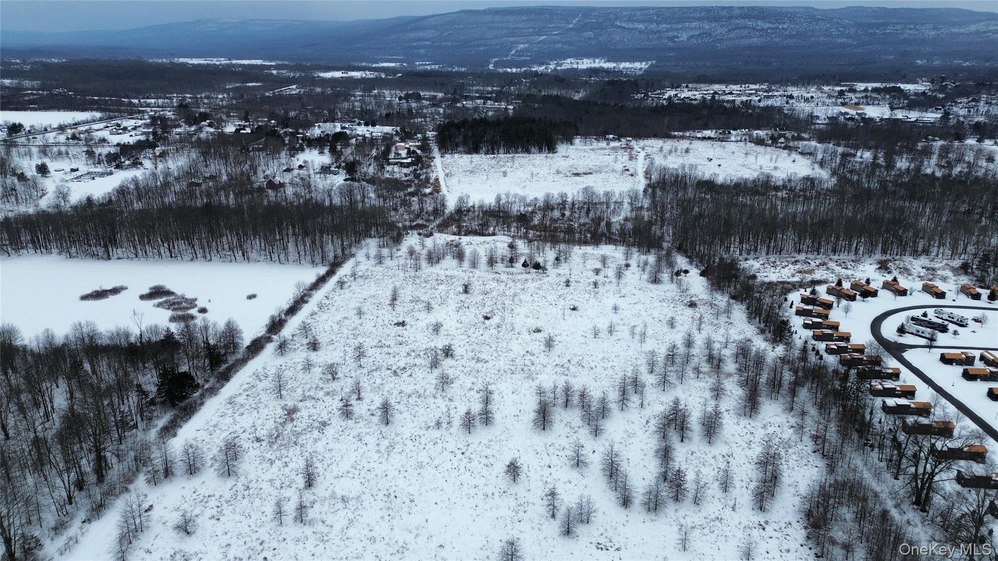Lot 11 Albany Post Road Gardiner, NY 12525 - Photo 7 of 11 a view of a lake with a mountain in the background