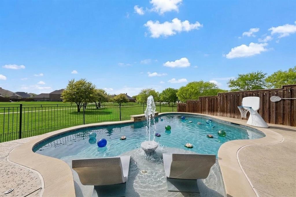 7625 Ridgedale Court Sachse, TX 75048 - Photo 38 of 40 AI, View of swimming pool with a fenced backyard and patio surround