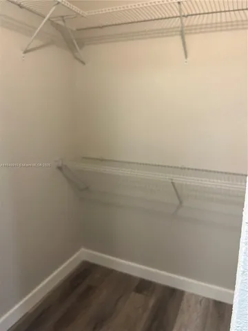 a view of a room with racks on the wall