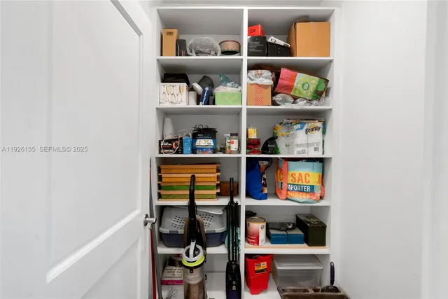 a shelf with books and knick knacks on it