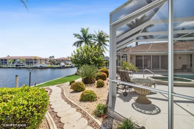 a view of swimming pool with seating area and barbeque oven