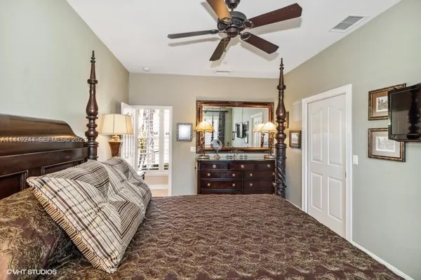 a bedroom with a bed and a dresser