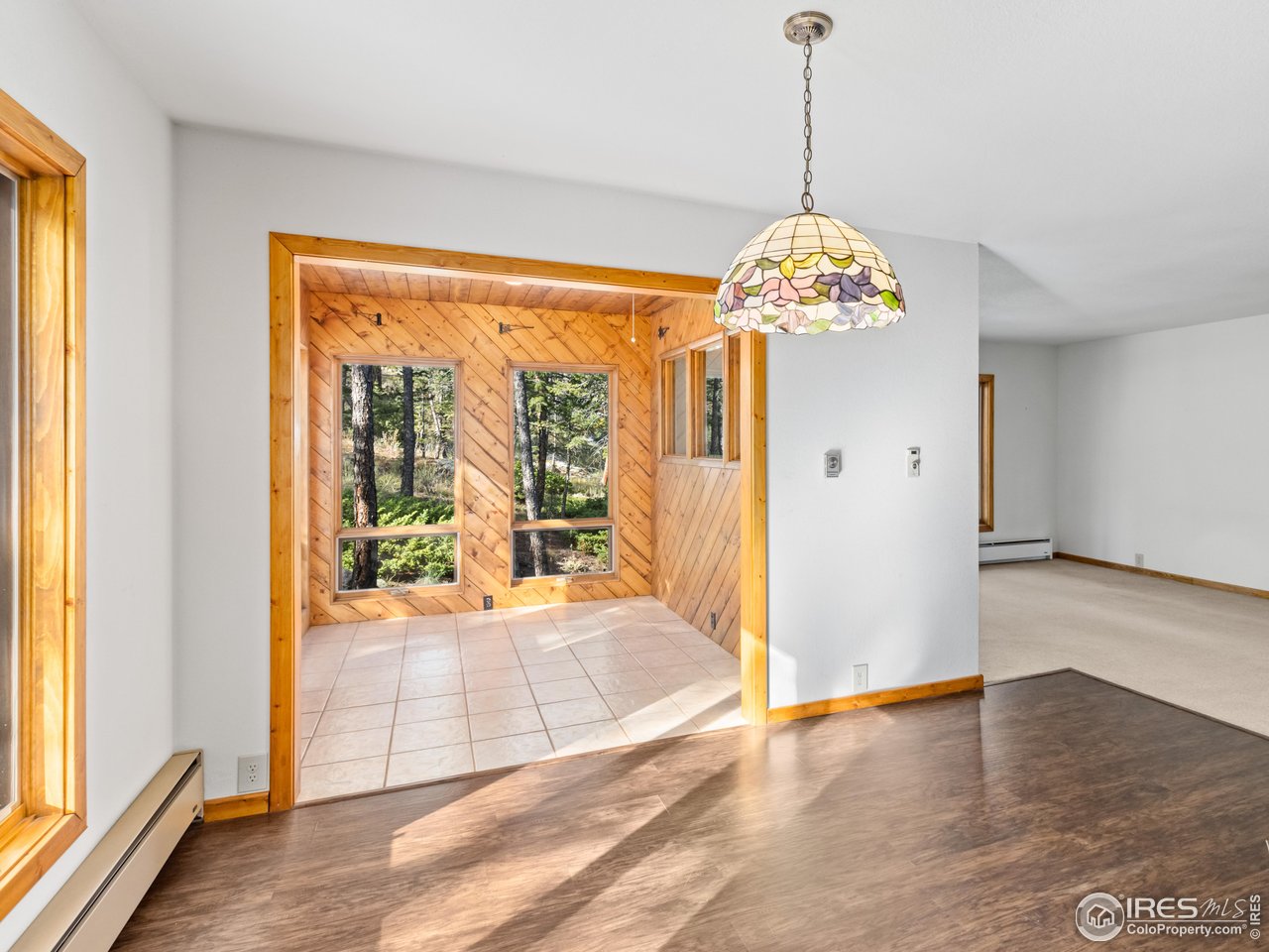 255 Apache Road Lyons, CO 80540 - Photo 7 of 33 Dining room and sun room