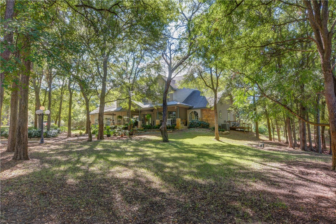 236 Piney Ridge Drive Bastrop, TX 78602 - Photo 1 of 1 a swimming pool with outdoor seating and yard
