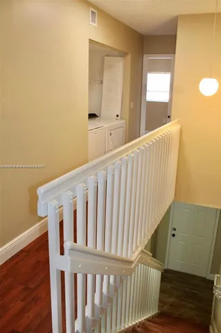 a view of a hallway with staircase