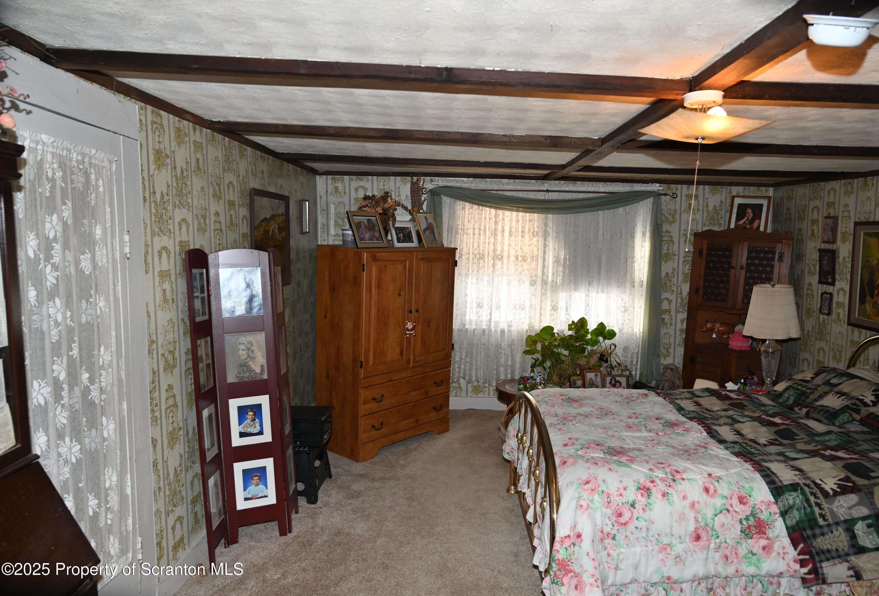 358 Barney Hollow Road Nicholson, PA 18446 - Photo 14 of 61 a bed room with a bed and a chair