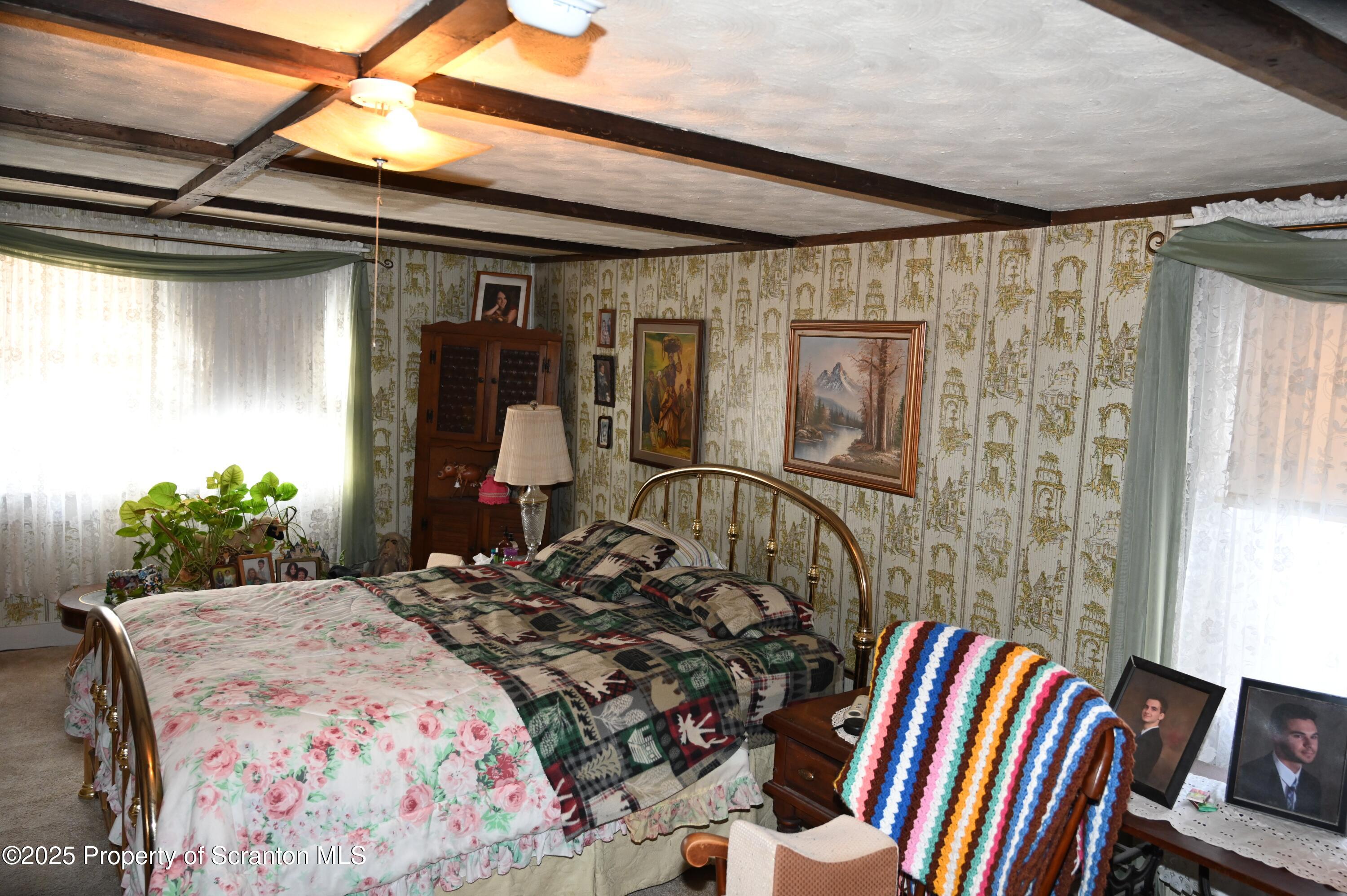 358 Barney Hollow Road Nicholson, PA 18446 - Photo 15 of 61 a bedroom with a bed and a mirror