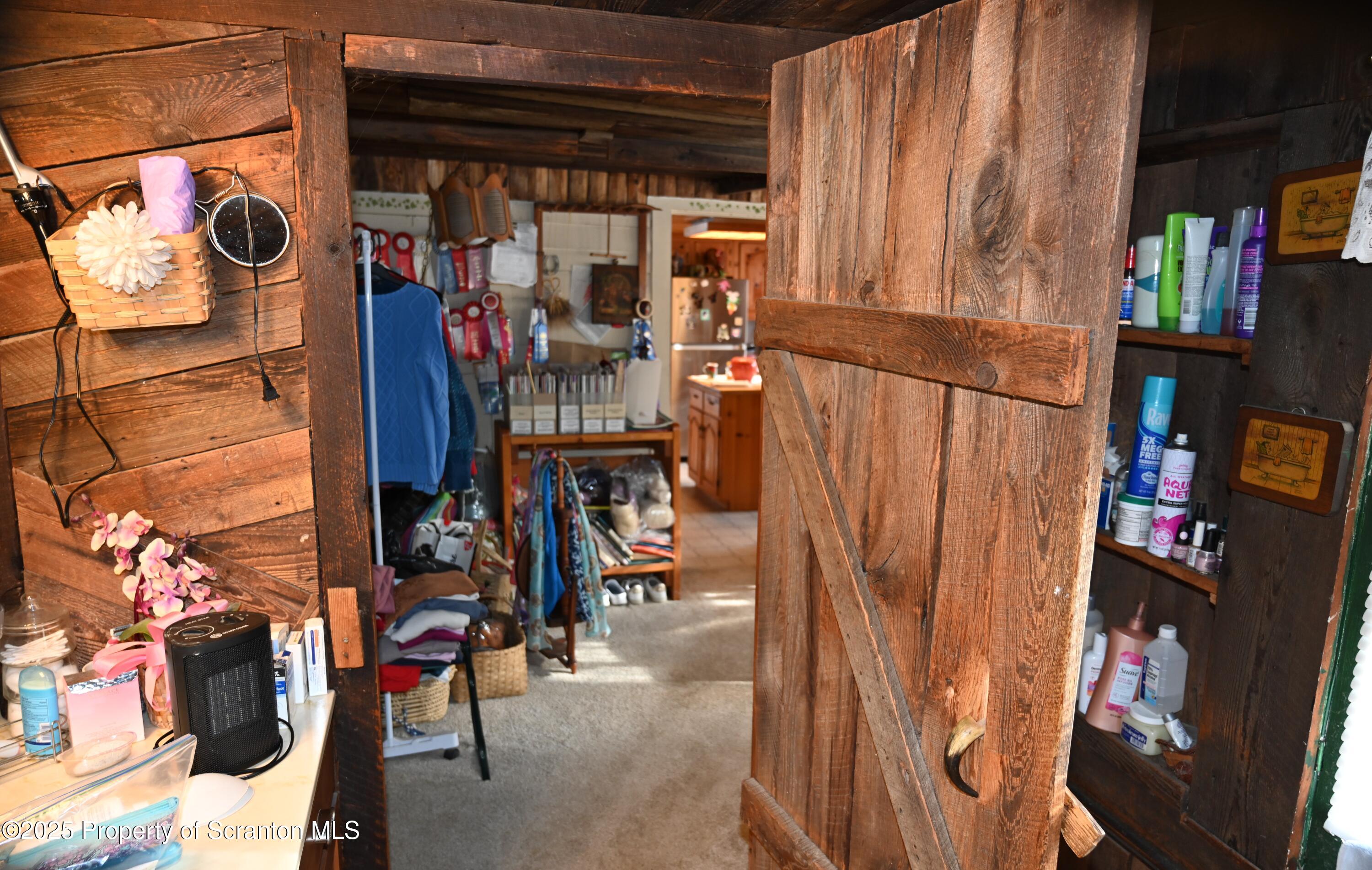 358 Barney Hollow Road Nicholson, PA 18446 - Photo 19 of 61 a view of walk in closet with clothes