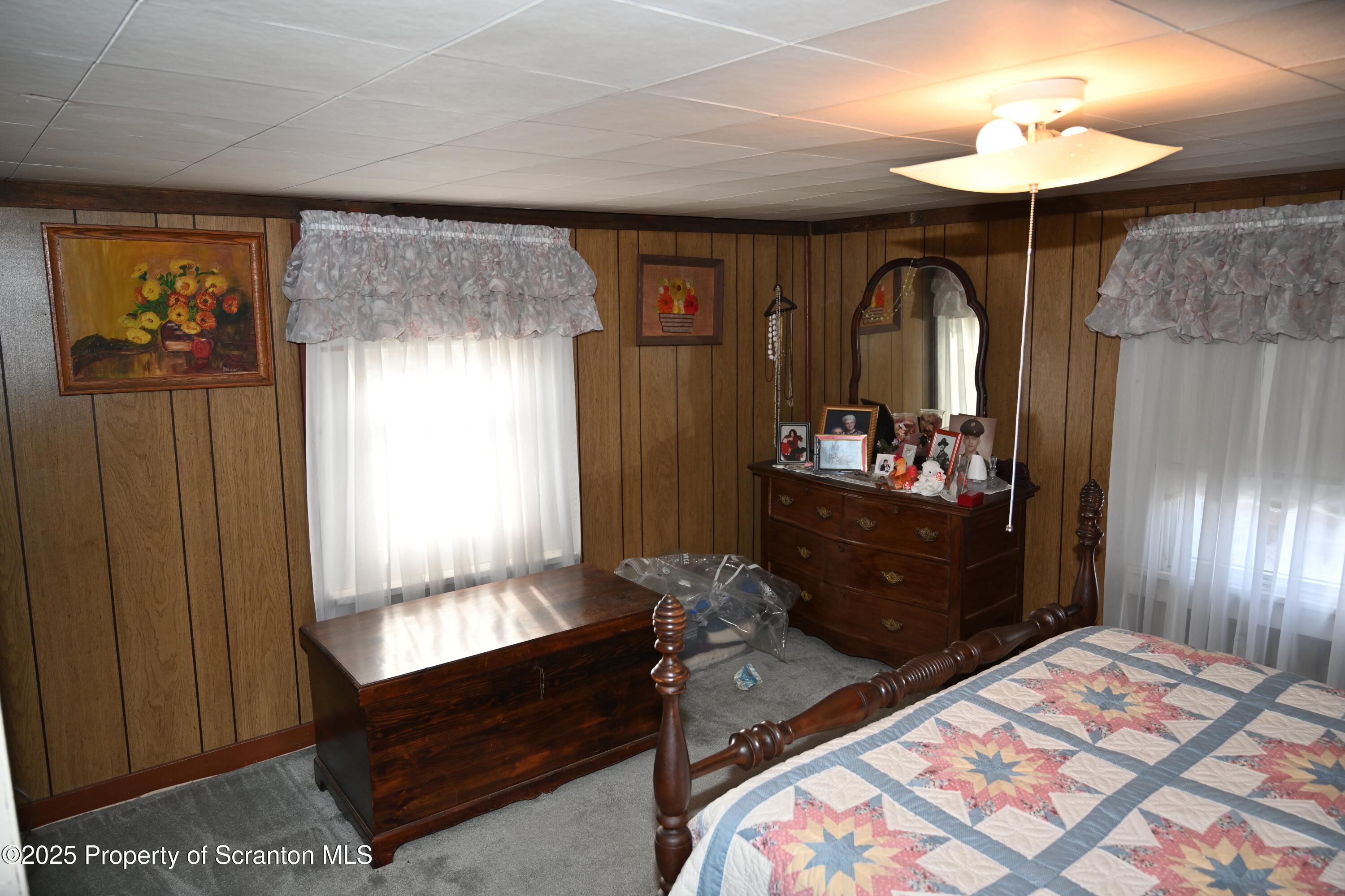 358 Barney Hollow Road Nicholson, PA 18446 - Photo 23 of 61 a bedroom with a bed and a dresser