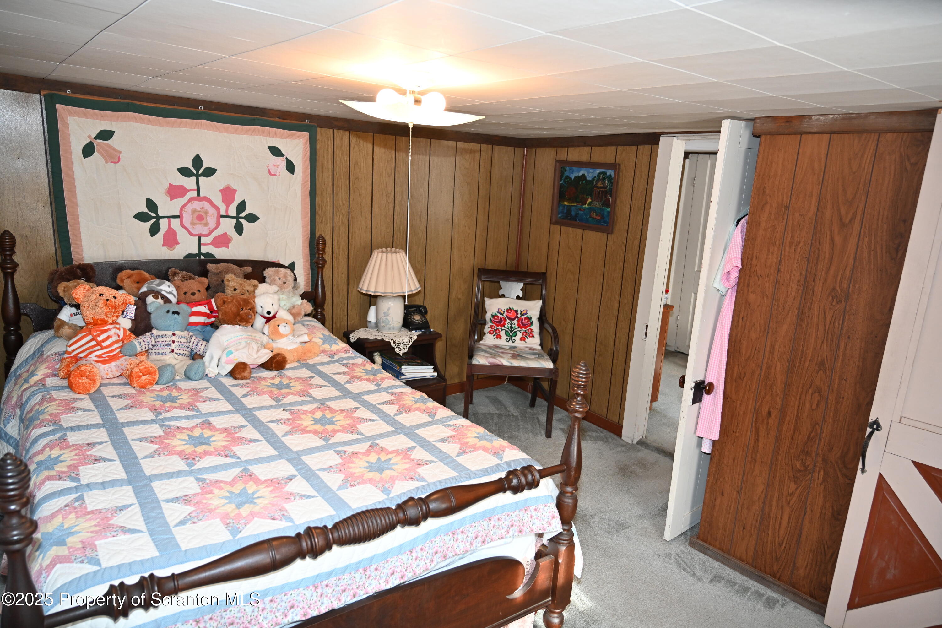 358 Barney Hollow Road Nicholson, PA 18446 - Photo 24 of 61 a bed room with a bed and a couch