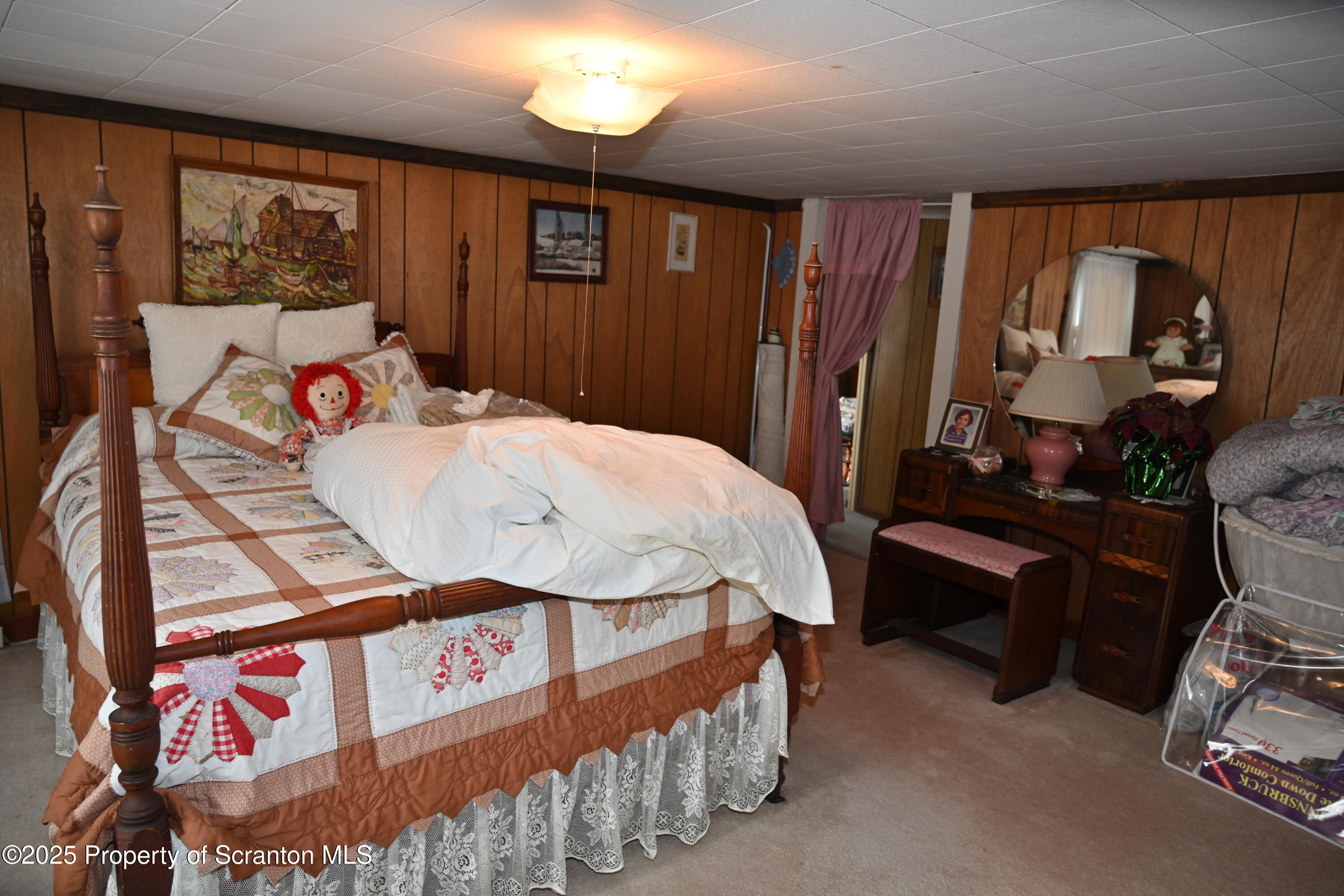 358 Barney Hollow Road Nicholson, PA 18446 - Photo 28 of 61 a bedroom with a bed a dresser and next to a window