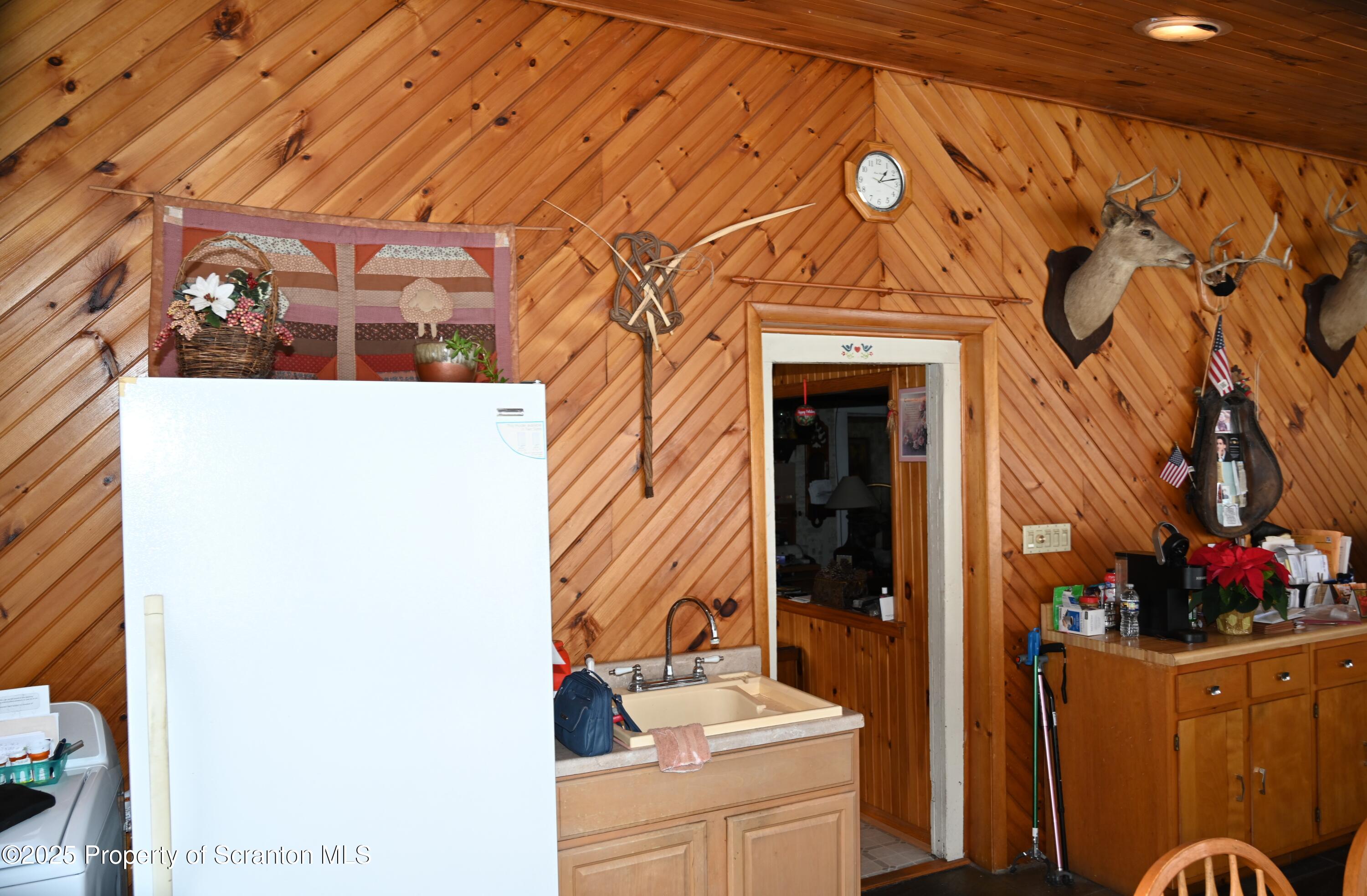 358 Barney Hollow Road Nicholson, PA 18446 - Photo 32 of 61 a bathroom with a sink and mirror with bathtub
