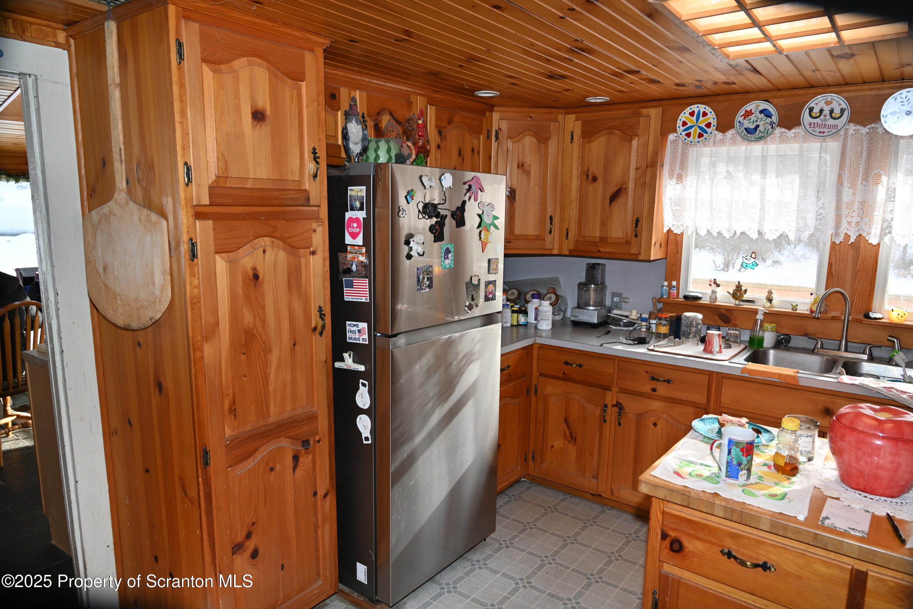 358 Barney Hollow Road Nicholson, PA 18446 - Photo 4 of 61 a kitchen with refrigerator and window