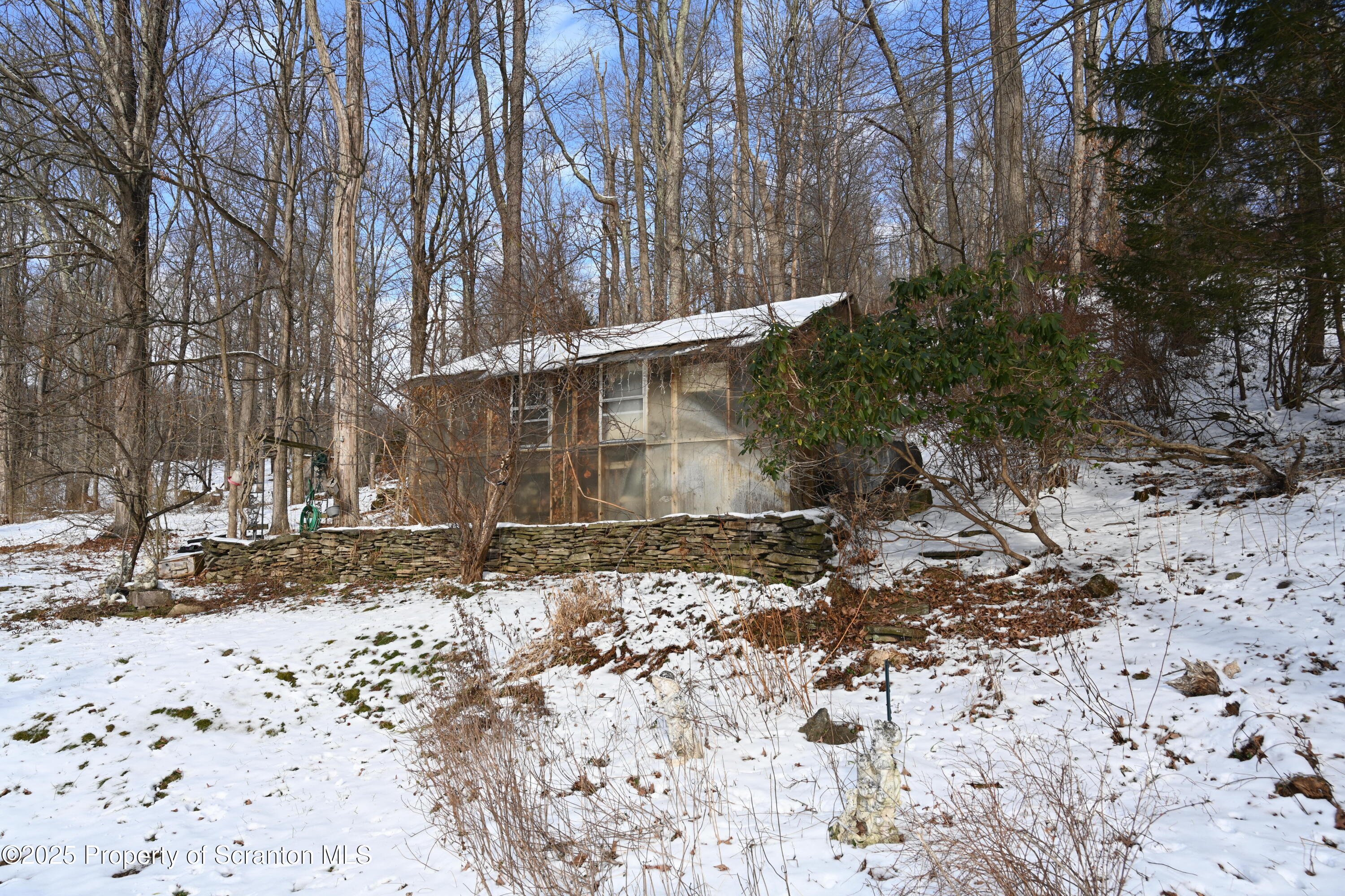 358 Barney Hollow Road Nicholson, PA 18446 - Photo 44 of 61 a backyard of a house with large trees
