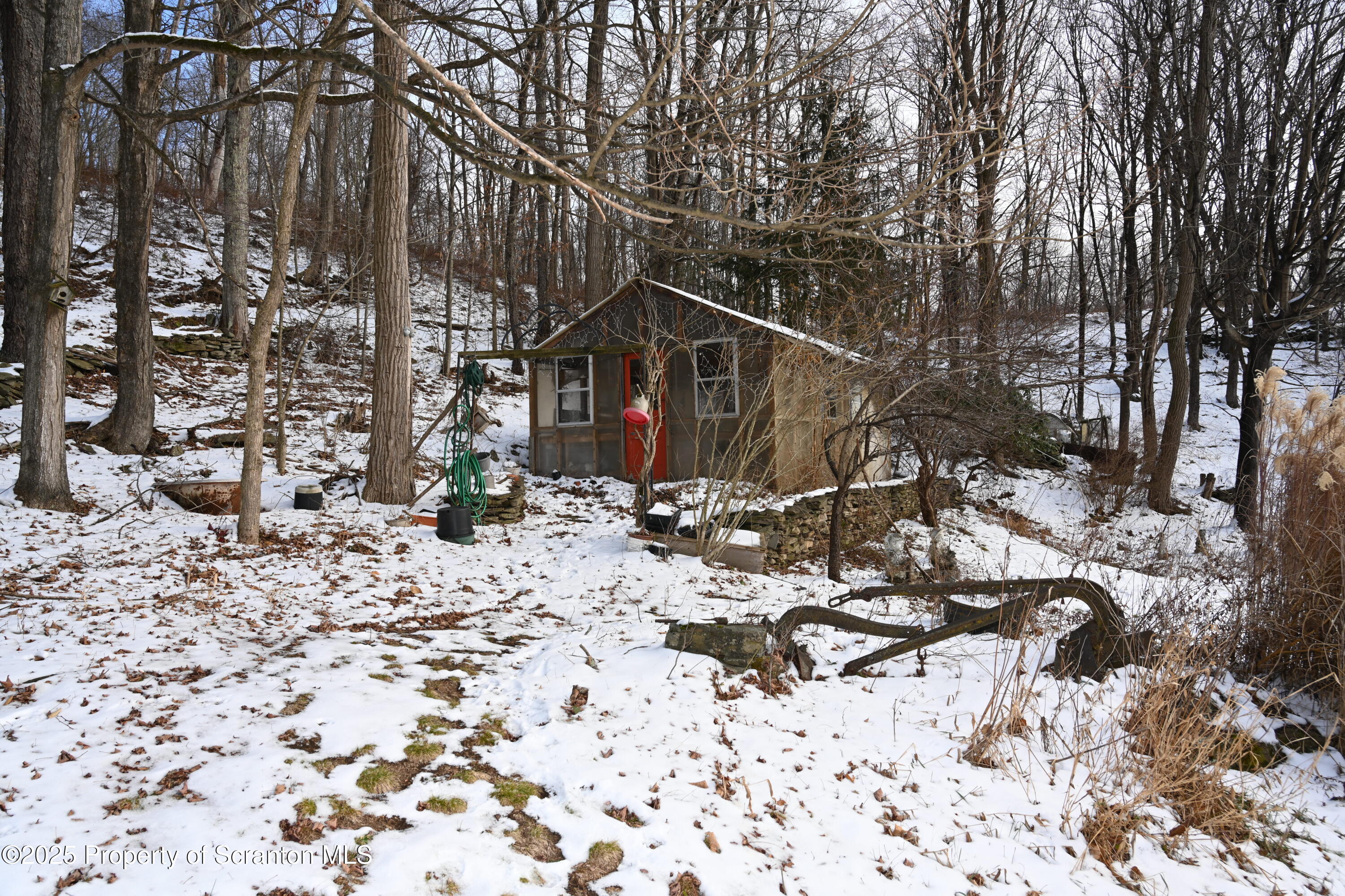 358 Barney Hollow Road Nicholson, PA 18446 - Photo 45 of 61 a view of a house with a yard covered in snow