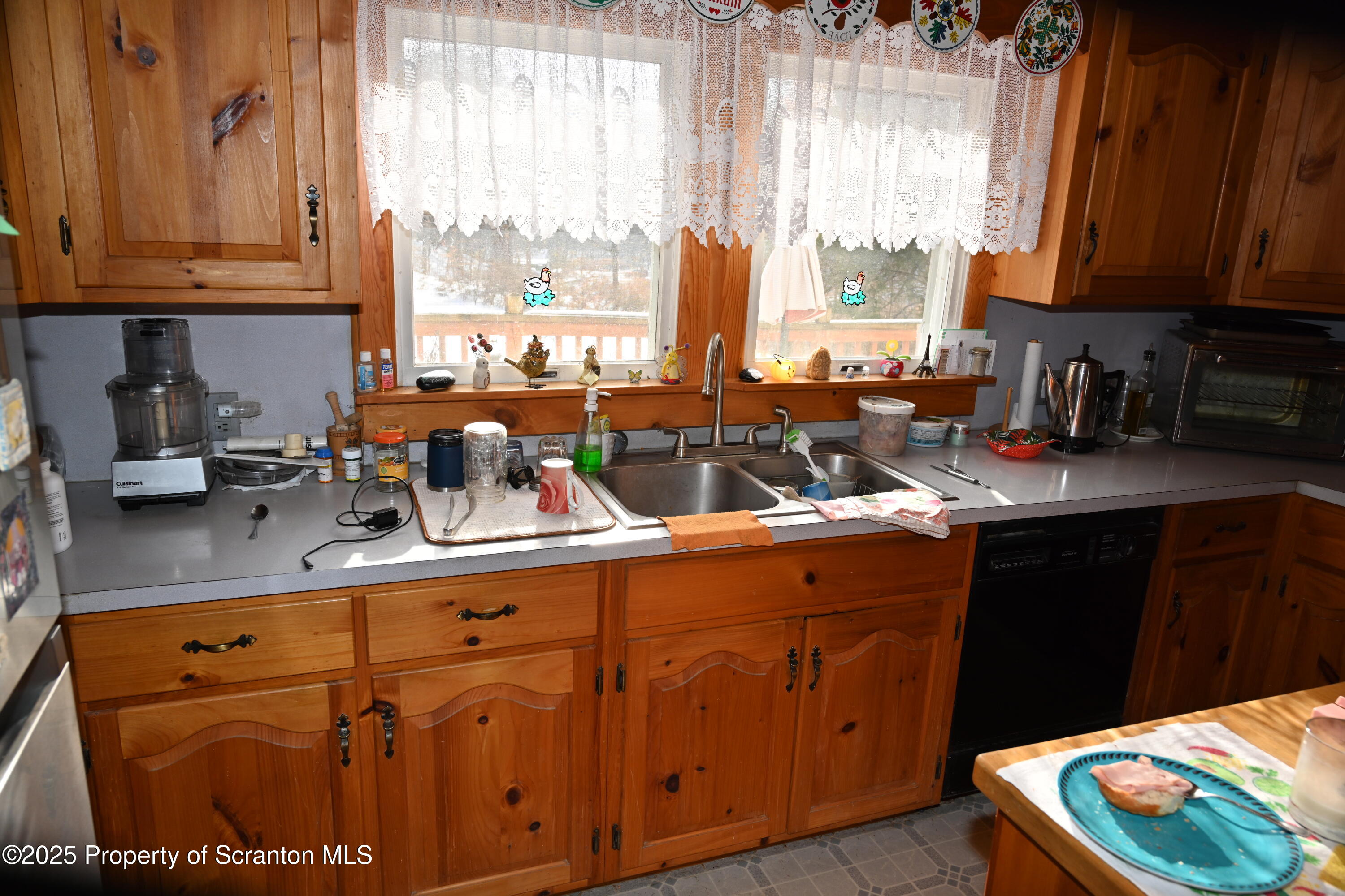 358 Barney Hollow Road Nicholson, PA 18446 - Photo 7 of 61 a kitchen with stainless steel appliances granite countertop a stove a sink dishwasher and cabinets with wooden floor