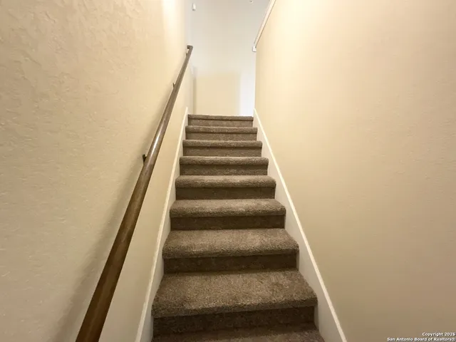 a view of a hallway with staircase