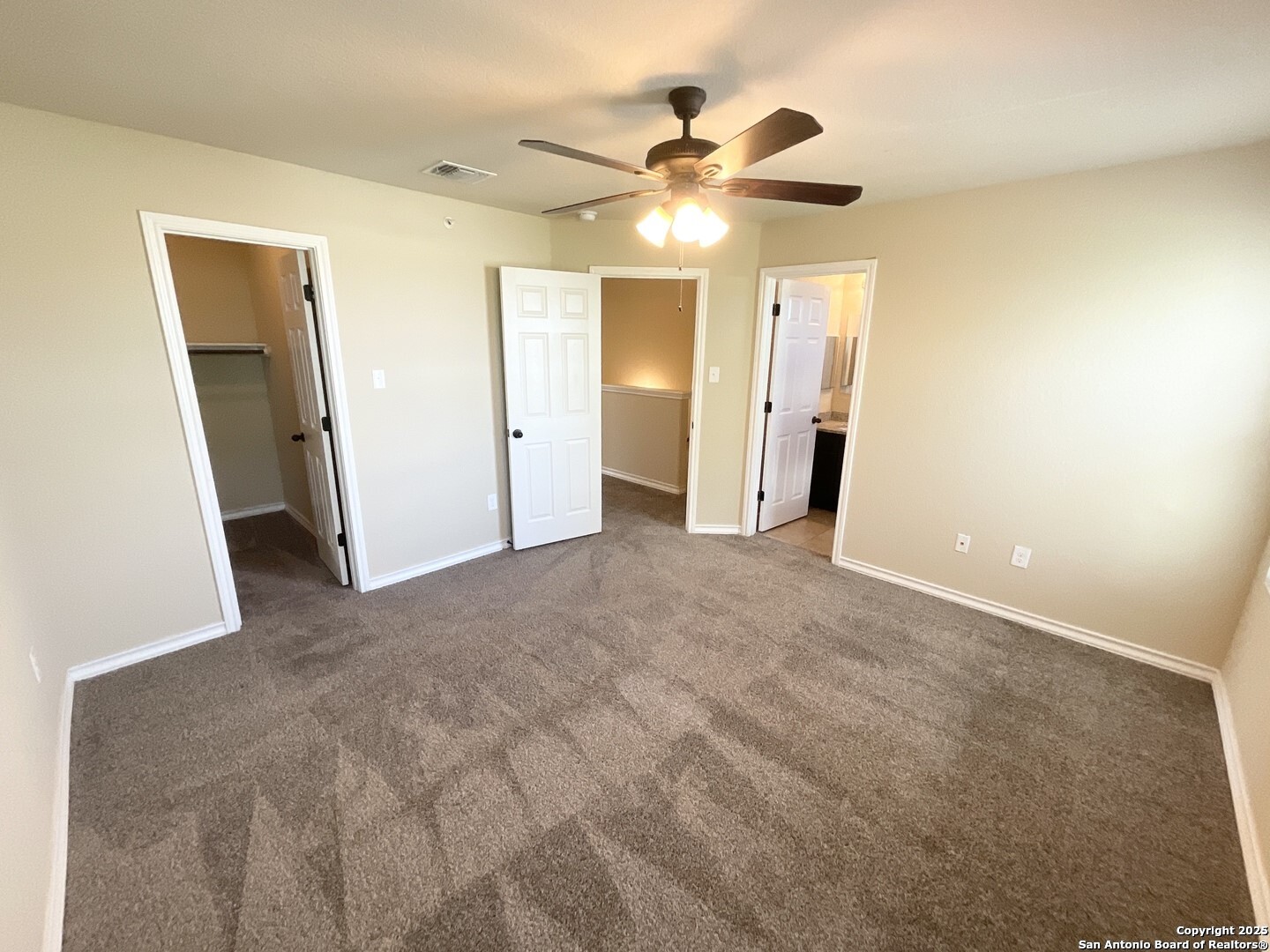 16820 Dancing Ava, Unit 2 Selma, TX 78154 - Photo 17 of 28 a view of a hallway with a chandelier fan