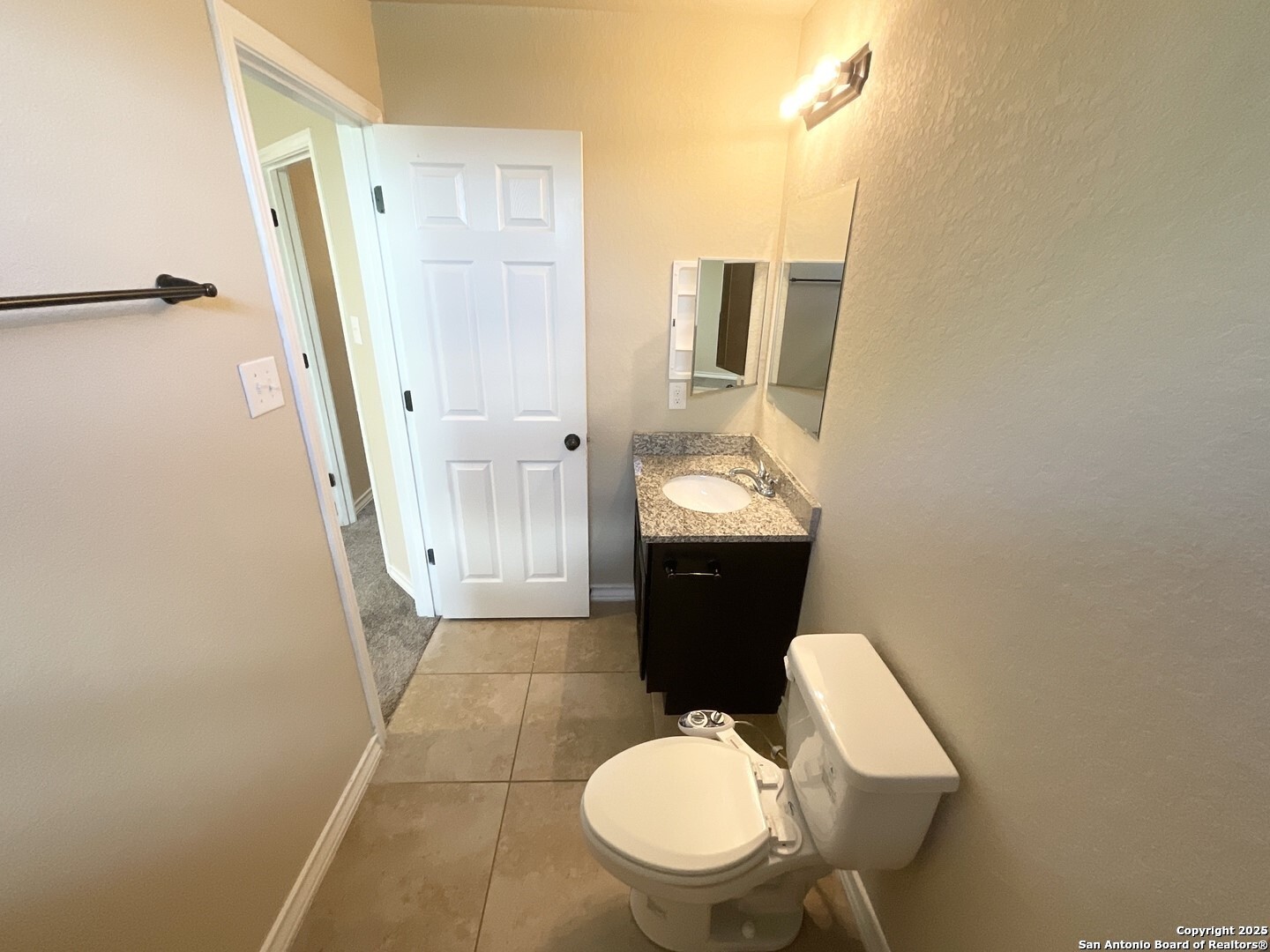 16820 Dancing Ava, Unit 2 Selma, TX 78154 - Photo 20 of 28 a bathroom with a sink a toilet a mirror and shower