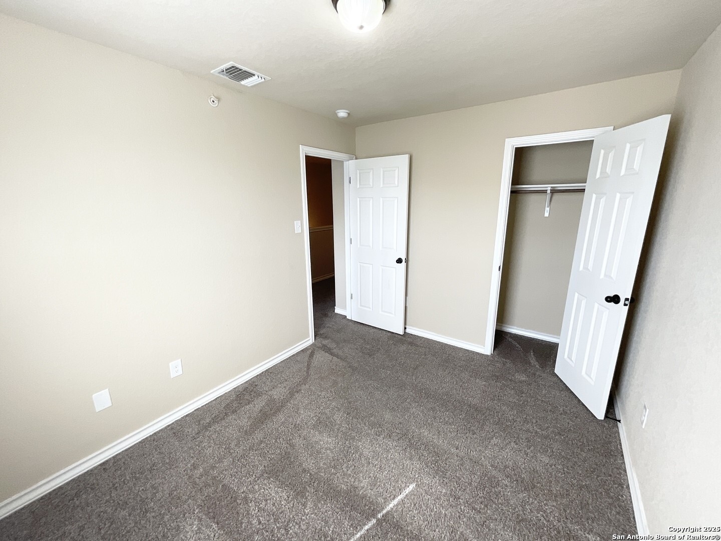 16820 Dancing Ava, Unit 2 Selma, TX 78154 - Photo 24 of 28 a view of an empty room with a mirror