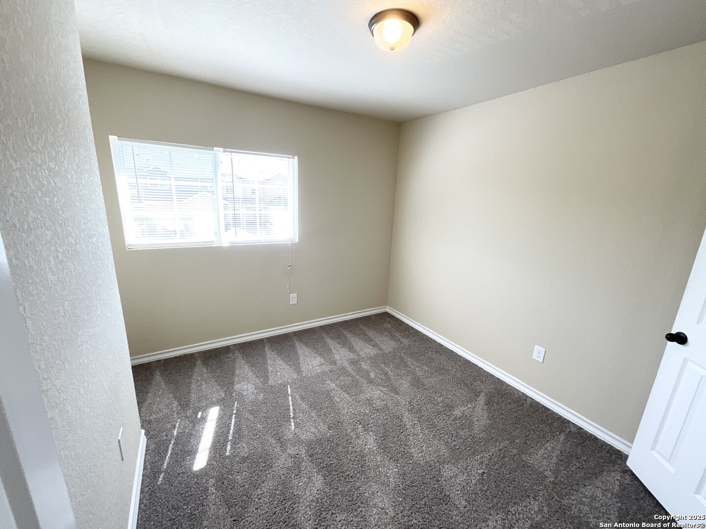 16820 Dancing Ava, Unit 2 Selma, TX 78154 - Photo 25 of 28 an empty room with a window
