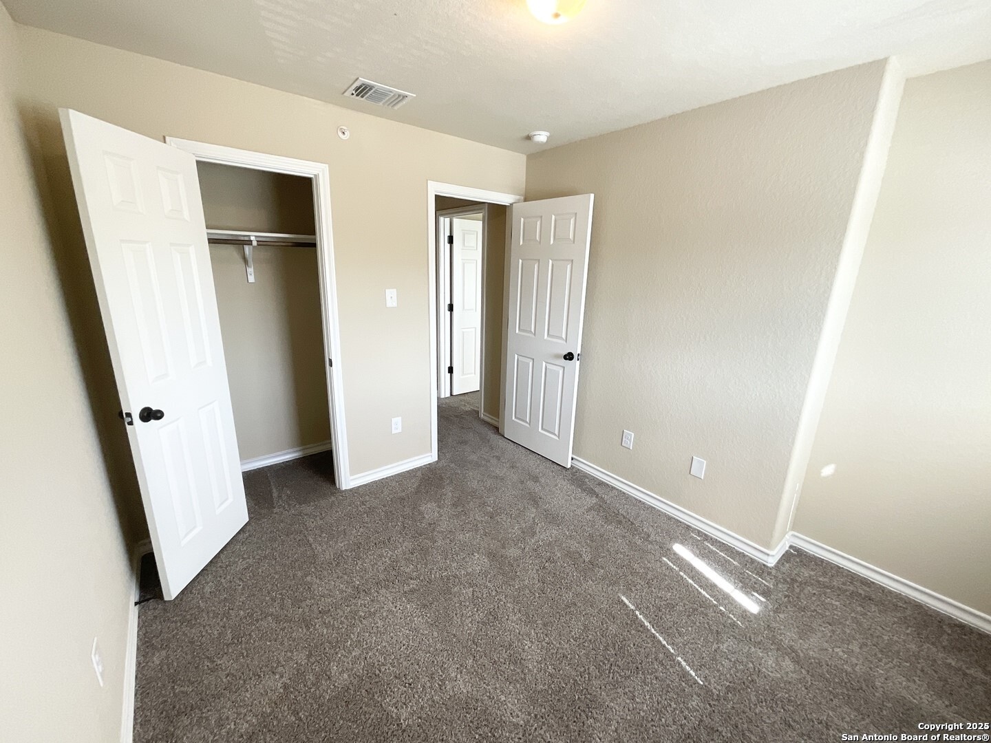 16820 Dancing Ava, Unit 2 Selma, TX 78154 - Photo 26 of 28 a view of a hallway with closet and wooden floor