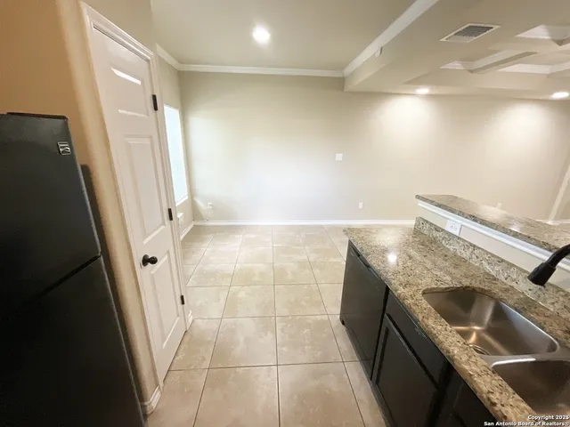 a view of a kitchen with a sink