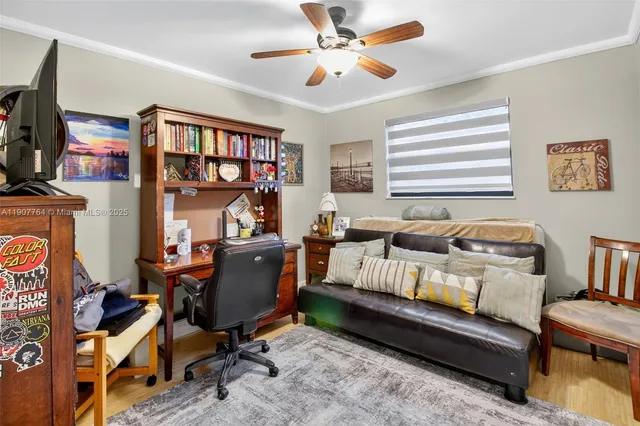 a bedroom with a bed and a flat tv screen