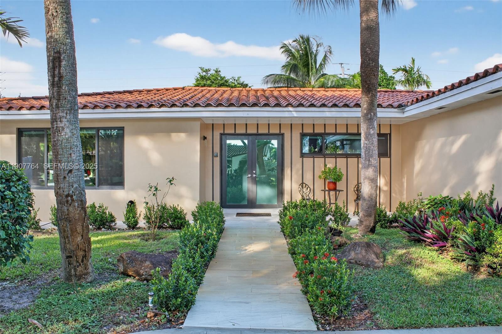 15010 Dunbarton Place Miami Lakes, FL 33016 - Photo 6 of 36 a front view of a house with garden
