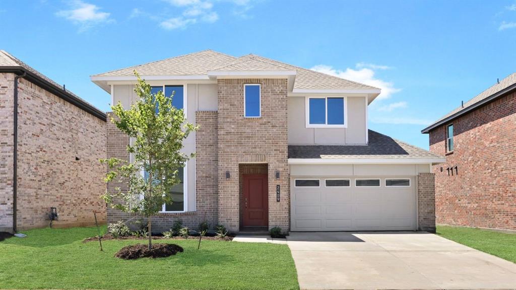 2310 Rise Ridge Road Grand Prairie, TX 75052 - Photo 1 of 1 a front view of a house with a yard and garage
