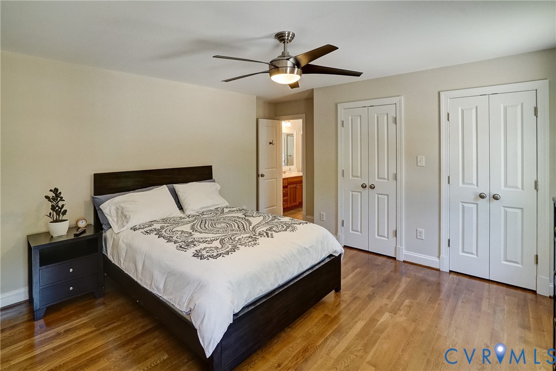 1295 Hermitage Road Manakin-Sabot, VA 23103 - Photo 51 of 55 a bedroom with a bed and a chandelier