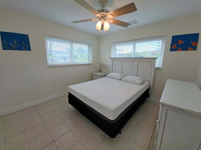 a bathroom with a sink and mirror with toilet