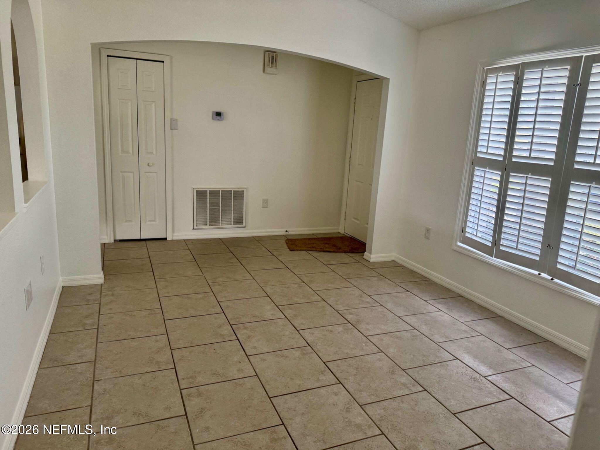 11447 Exmore Street Spring Hill, FL 34609 - Photo 14 of 31 a view of an empty room and window