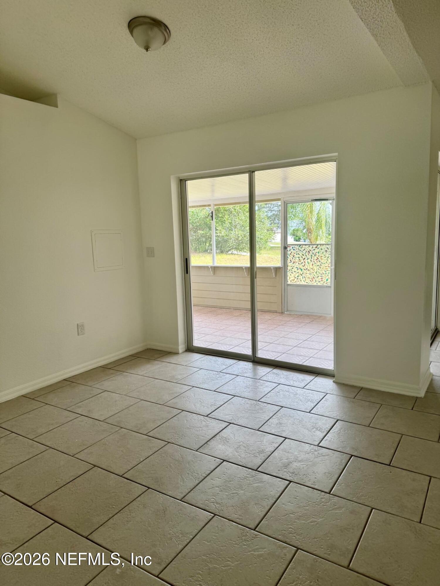 11447 Exmore Street Spring Hill, FL 34609 - Photo 16 of 31 a view of an empty room and window