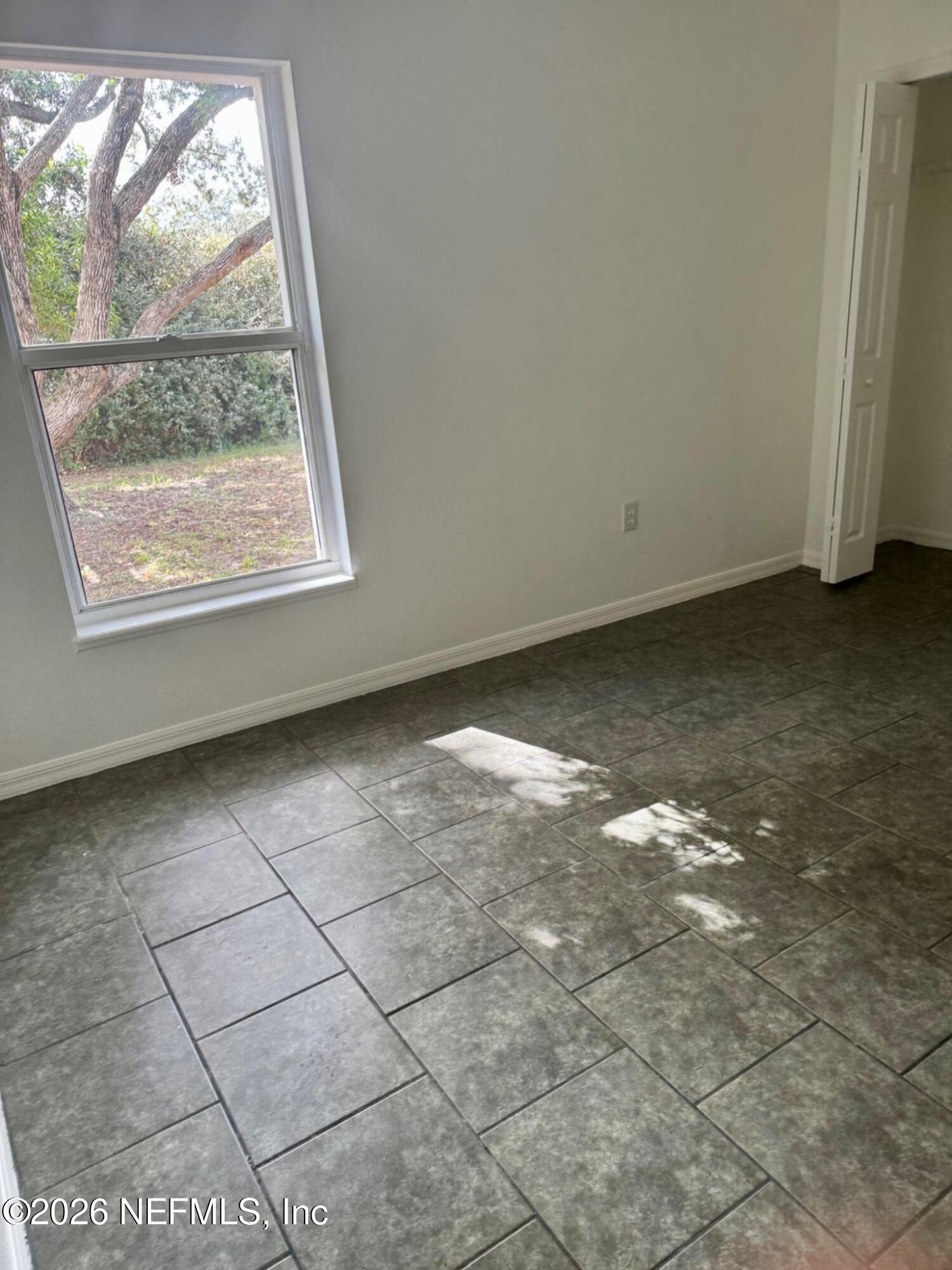 11447 Exmore Street Spring Hill, FL 34609 - Photo 24 of 31 an empty room with a window