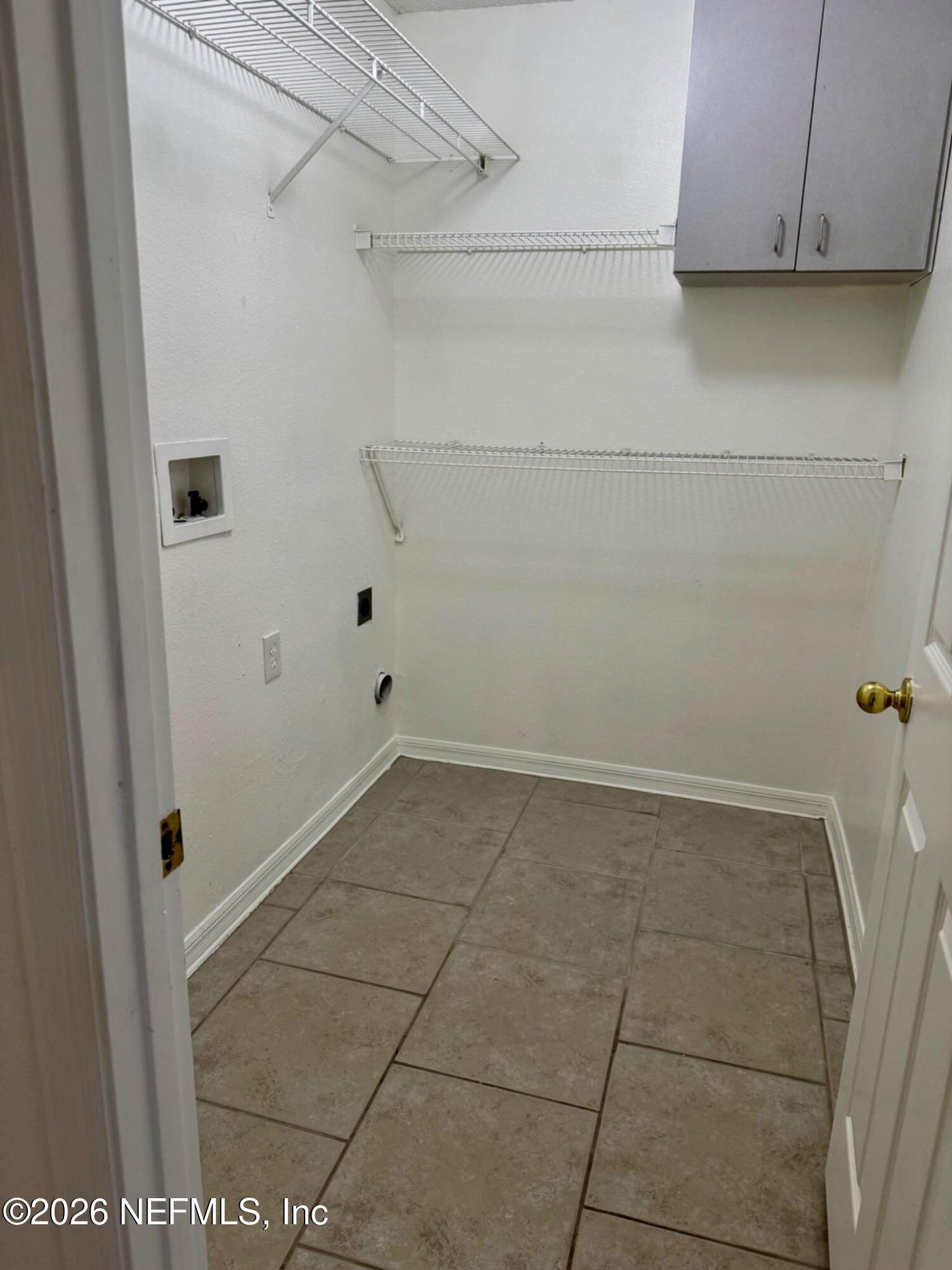 11447 Exmore Street Spring Hill, FL 34609 - Photo 25 of 31 a view of a utility room with closet