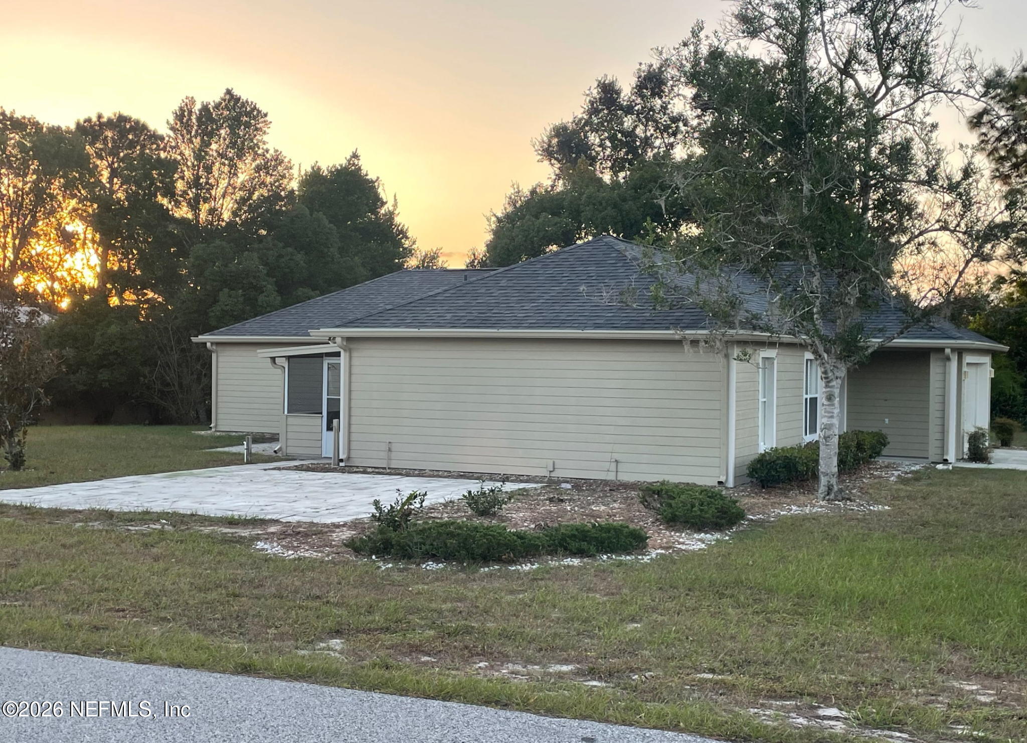 11447 Exmore Street Spring Hill, FL 34609 - Photo 5 of 31 a front view of house with yard and trees