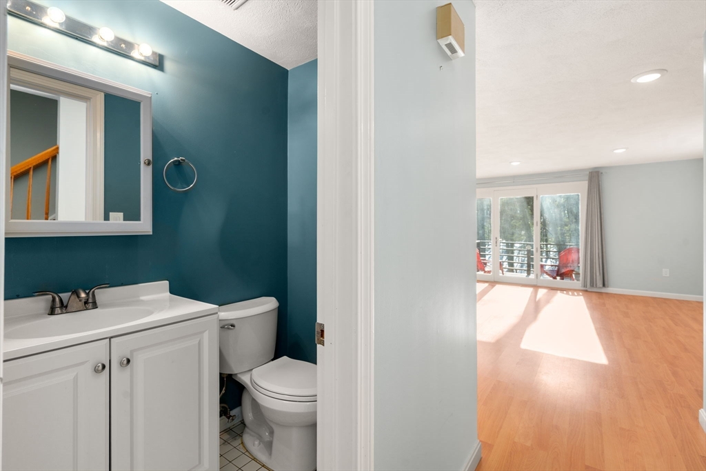 9 Oak Ridge Drive, Unit 6 Maynard, MA 01754 - Photo 15 of 39 a bathroom with a toilet sink and mirror