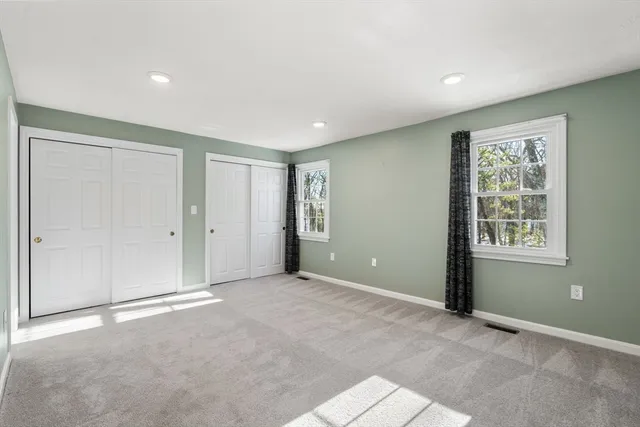 a bathroom with a granite countertop sink a large mirror and a shower
