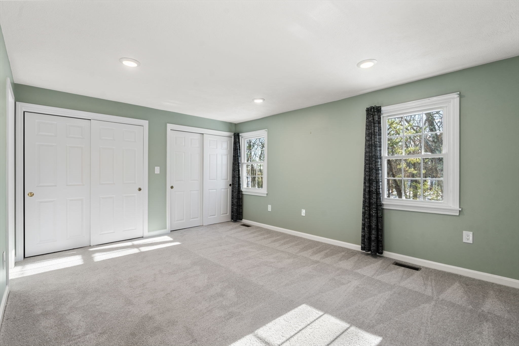 9 Oak Ridge Drive, Unit 6 Maynard, MA 01754 - Photo 20 of 39 an empty room with windows