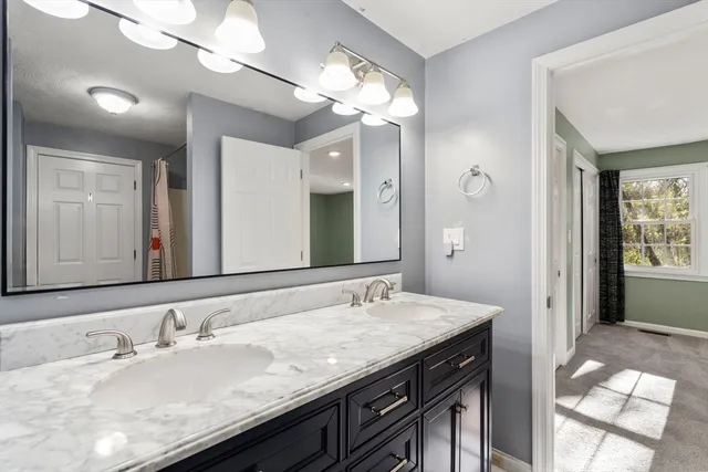 an aerial view of a house with a yard and mountain view