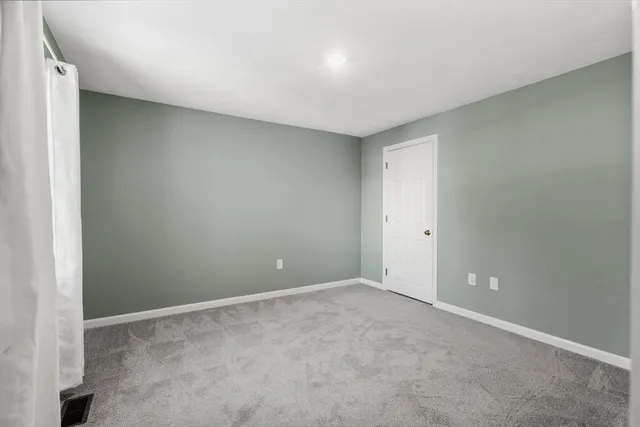 a front view of a house with yard and seating area